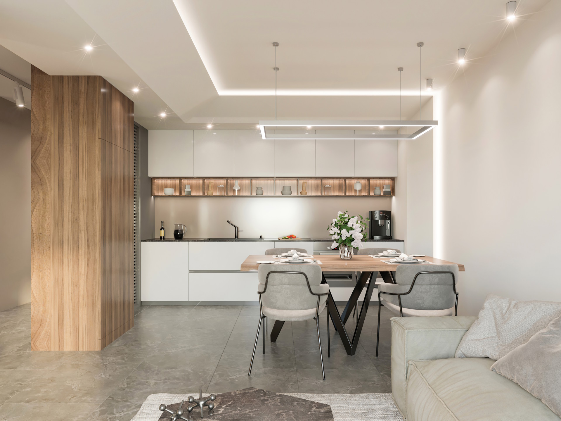 Die Vinyl und Linoleum Vorteile überzeugen durch ihre hohe Strapazierfähigkeit, Pflegeleichtigkeit und vielseitigen Designmöglichkeiten für moderne Wohn- und Arbeitsbereiche. Beide Bodenarten bieten eine langlebige, hygienische und komfortable Lösung, die sich ideal für stark frequentierte Räume und stilvolle Inneneinrichtungen eignet.  Bildbeschreibung: Das Bild zeigt eine moderne, helle Wohnküche mit großformatigen Bodenfliesen in Steinoptik. Ein Esstisch mit vier gepolsterten Stühlen steht im Vordergrund, dahinter befindet sich eine geradlinige Küchenzeile in Weiß mit Holz- und Beleuchtungselementen. Links ist eine große Holzverkleidung sichtbar, rechts ein beigefarbenes Sofa.