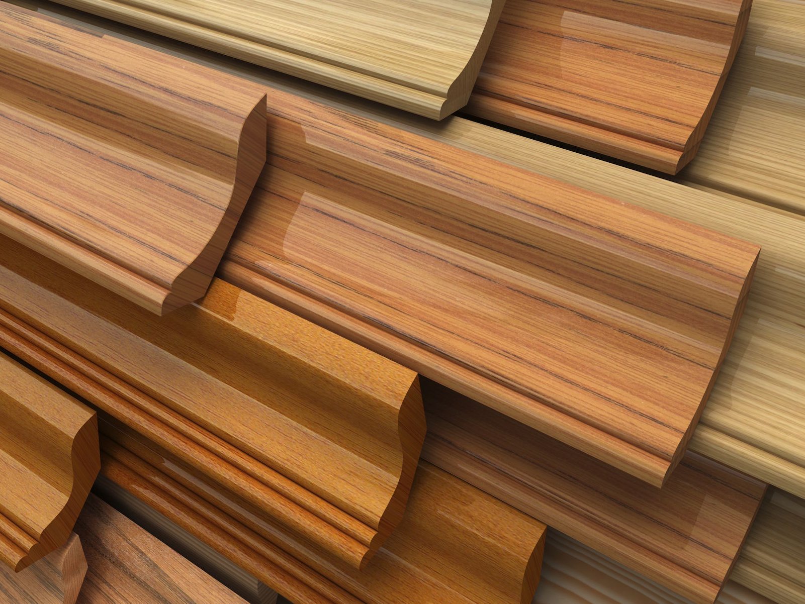 Hochwertige Parkett Sockelleisten in Altenburg, Gera, Schmölln, Ronneburg und Leipzig sorgen für einen perfekten Übergang zwischen Wand und edlem Parkettboden. Mit passender Holzoptik, präziser Verarbeitung und langlebiger Qualität schaffen sie ein harmonisches Gesamtbild und verleihen jedem Raum ein professionelles, stilvolles Finish.  Bildbeschreibung: Das Bild zeigt mehrere übereinander gestapelte Sockelleisten aus Holz in verschiedenen warmen Farbtönen. Die Leisten besitzen unterschiedliche Profile und Maserungen, wodurch verschiedene Designs und Einsatzmöglichkeiten deutlich werden.